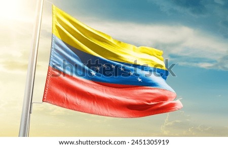 Venezuela national flag waving in beautiful sky.