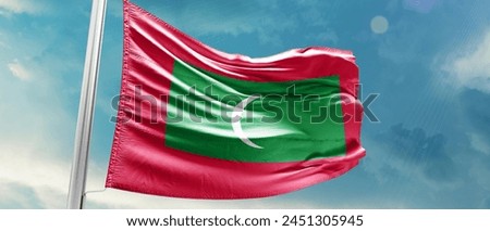 Maldives national flag waving in beautiful sky.
