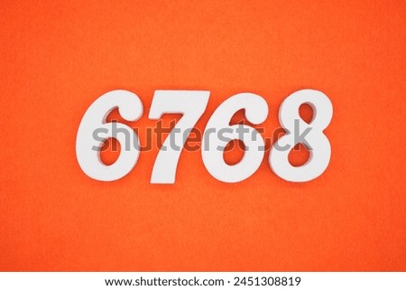 Orange felt is the background. The numbers 6768 are made from white painted wood.