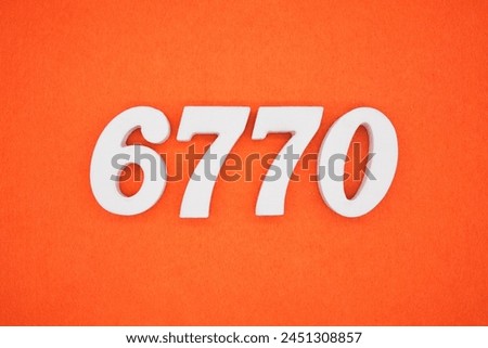 Orange felt is the background. The numbers 6770 are made from white painted wood.