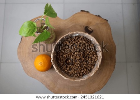 Composing a picture with coffee, oranges and a tree