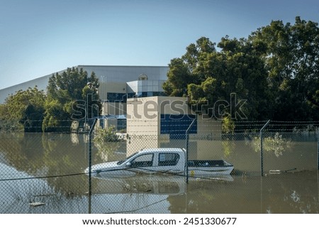Sunken pick up truck. Consequences of the storm in Dubai Royalty-Free Stock Photo #2451330677