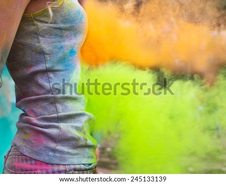 Happy young girl on holi color festival. Close up