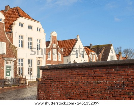 the village of Greetsiel at the north sea in germany Royalty-Free Stock Photo #2451332099