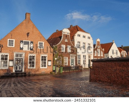 the village of Greetsiel at the north sea in germany Royalty-Free Stock Photo #2451332101