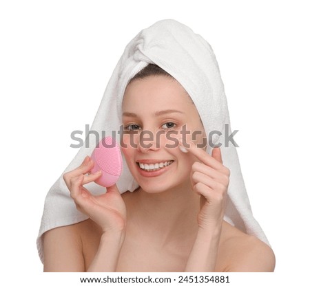 Washing face. Young woman with brush and cleansing foam on white background