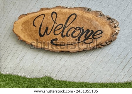 Welcome sign on wooden board