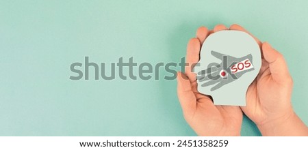 Domestic violence, hand hits face of abused woman, international awareness month october for victims and survivors  Royalty-Free Stock Photo #2451358259