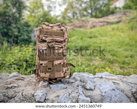 army military backpack, camo bag, hiking gear and accessories, nature background