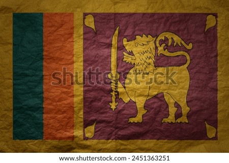 colorful big national flag of sri lanka on a grunge old paper texture background