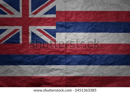 colorful big national flag of hawaii state on a grunge old paper texture background
