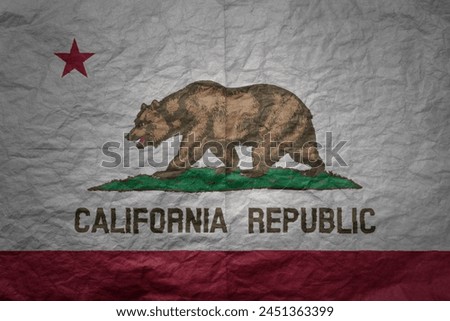 colorful big national flag of california state on a grunge old paper texture background