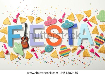 The inscription Fiesta with decorations on a white background