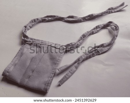 Mask texture made of simple cloth with dark gray and white background