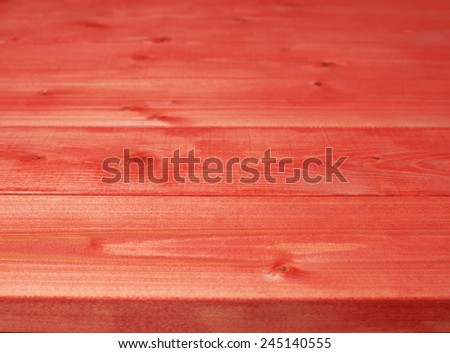 Surface covered with the multiple red paint coated pine wood boards as a shallow depth of field background composition