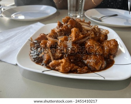 cooked spicy chicken slice on the plate