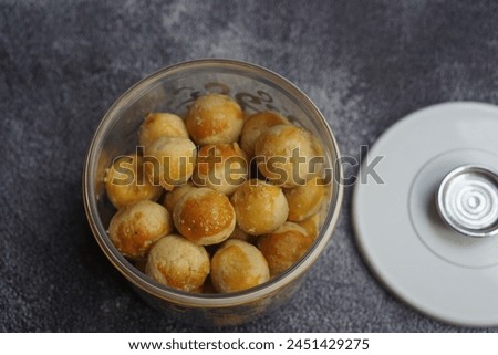 Nastar Cookies, Pineapple tarts or nanas tart are small, bite-size pastries filled or topped with pineapple jam, commonly found when Hari Raya or Eid Al Fitr or Lebaran. Selective focus. Royalty-Free Stock Photo #2451429275