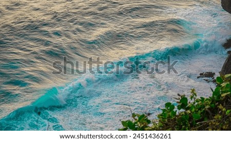 Beautiful aerial top view background photo of ocean sea water blue waves splashing in the deep sea.