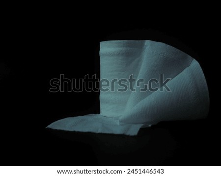 Toilet paper on a black background