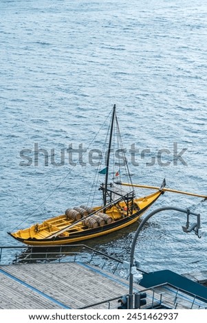 The Rabelo Boats, traditional wooden boats that transport barrels of wine on the Douro River, Portugal. Royalty-Free Stock Photo #2451462937