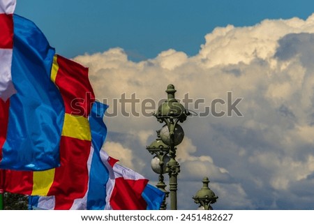 Vintage lanterns and naval flags coloring on the Trinity Bridge in St. Petersburg, Russia. Royalty-Free Stock Photo #2451482627