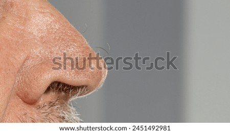 senior man close-up of  nose 