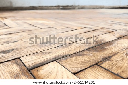 Old parquet background, texture. Old parquet before restoration in an apartment room. Wooden floor background. Old wooden floor in a house.