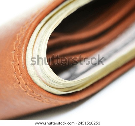 Close-up on a wallet with abstract product background.