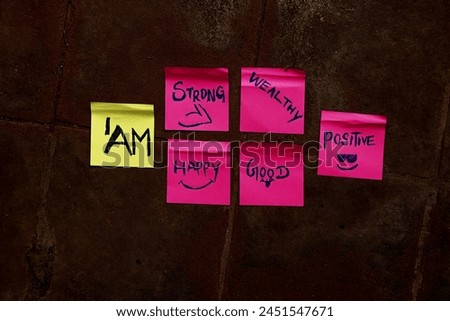 Concept I am strong happy wealthy  good positive yellow and pink sticky motivational backgrounds