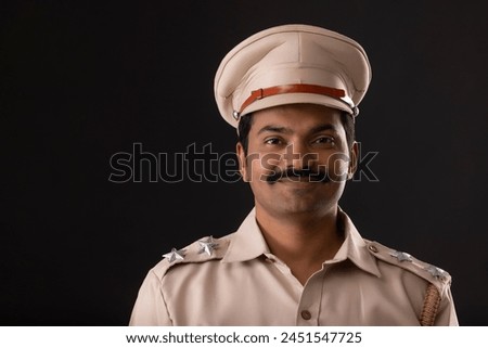 Close-up portrait of an Indian policeman