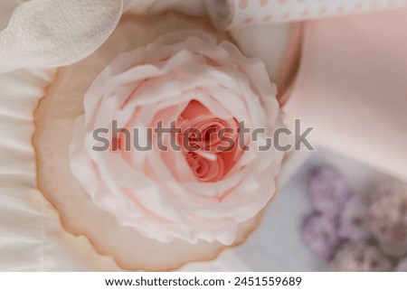 handmade candle in the shape of a flower on a light background, space for text. High quality photo