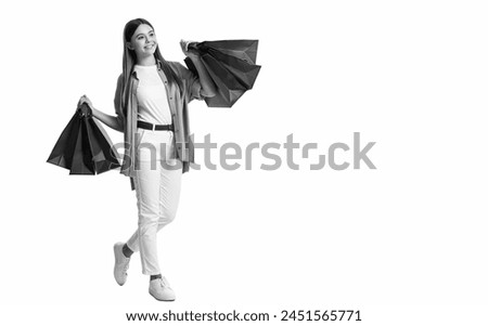 teen girl shopaholic with bags, copy space. teen girl shopaholic isolated on white. teen girl shopaholic in studio. teen girl shopaholic on background. Royalty-Free Stock Photo #2451565771