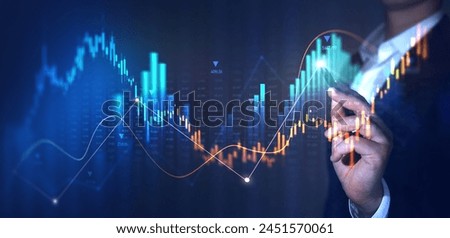 Trader analyzing data on virtual screen.Price graph and indicator. Stock market invest and crypto currency. Stock market and business investment.