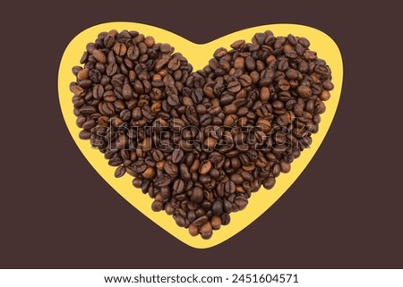 A pile of coffee beans in the shape of a heart on a brown background. Top view