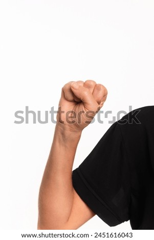 Close-up of a hand making the letter S in the sign language for the deaf in Brazil, Libras. Isolated on white background.
