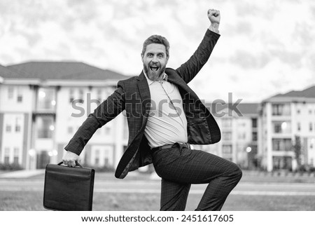 successful real estate business man outdoor. photo of real estate business man. real estate business man. real estate business man with briefcase