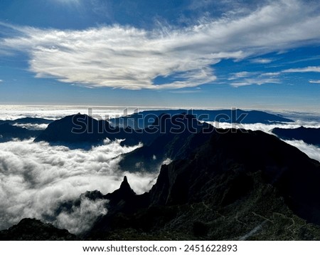 Beautiful cloud inversion with mountains and blue sky in madeira Royalty-Free Stock Photo #2451622893
