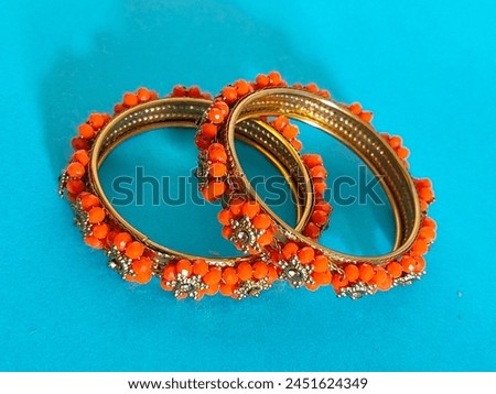 Orange pearl 2 pice bangles for girl bangles for women 2 pice bangles bridal wear women  Royalty-Free Stock Photo #2451624349
