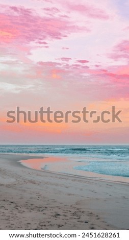 Beautiful and Colorful Outdoor Beach Evening Sunset with Pink Sky, Clouds, Sea view with Clear Blue Water Waves, Sandy Land with nobody there,  Peaceful Calm Sunlight Sun Set Beauty HD Image Photo