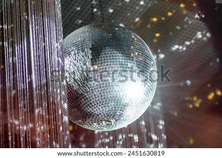 disco ball on a mirror 70s style