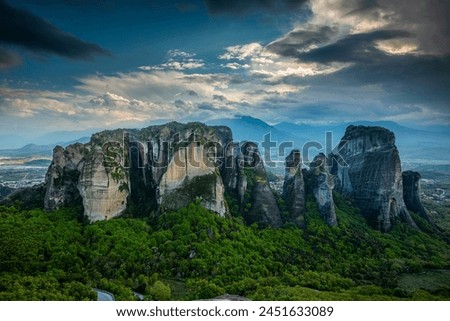 Cloud Dance: Tracking Shot of Meteora's Landscape with Sandstone Rock Formations and Ancient Monasteries in Full 4K image 