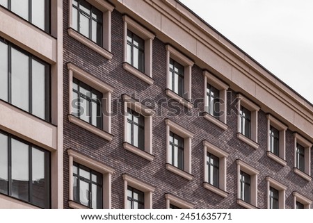 New house. Brick wall. Multi-storey building. Zhitroly quarter. Real estate market. Geometry of architecture. European city.