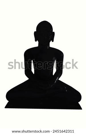 dark black stone statue of a Jain tirthankara Mahavira god,Mahavir Jayanti Celebration,jainism,yoga,zen concept,white Background Royalty-Free Stock Photo #2451642311
