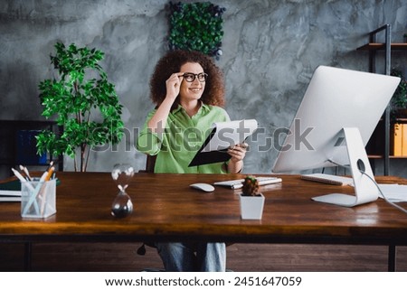 Photo of dreamy lovely woman office manager sitting working holding checklist blank list workspace workstation