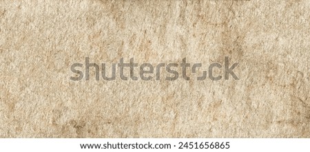 A high-resolution image of textured paper with a rough surface, showing natural fiber details and subtle color variations in shades of light brown and beige.