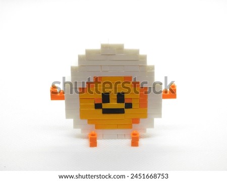 Kids toy : Brick of funny egg isolated with white background