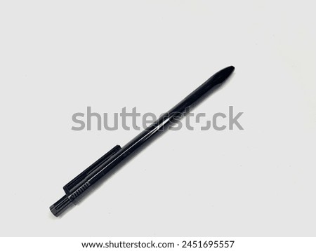 Picture of a black ballpoint pen in a plain white background