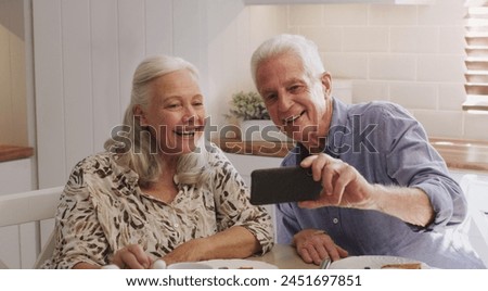 Mature couple, happy and selfie in kitchen at home with smile, retirement or bonding in marriage. Morning, photography and social media for profile picture, image post or elderly people with joy