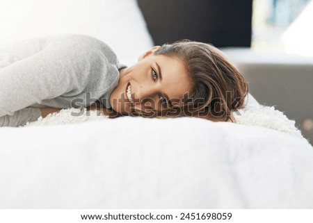 Woman, portrait and relax on bed in home with smile or weekend morning for peace, calm or resting. Female person, face and stress relief in apartment or comfort day off for Saturday, leisure or lying Royalty-Free Stock Photo #2451698059