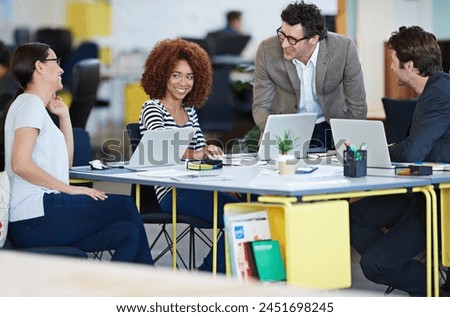 Brainstorming, business and teamwork in office for career start up company, meeting and seminar. Men, women and collaboration at desk with computer for web design, planning and discuss development. Royalty-Free Stock Photo #2451698245